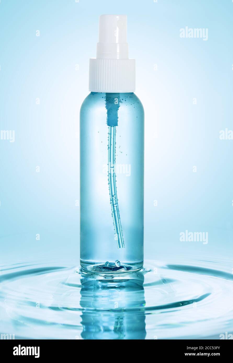 lotion spray bottle isolated on water ripple Stock Photo Alamy
