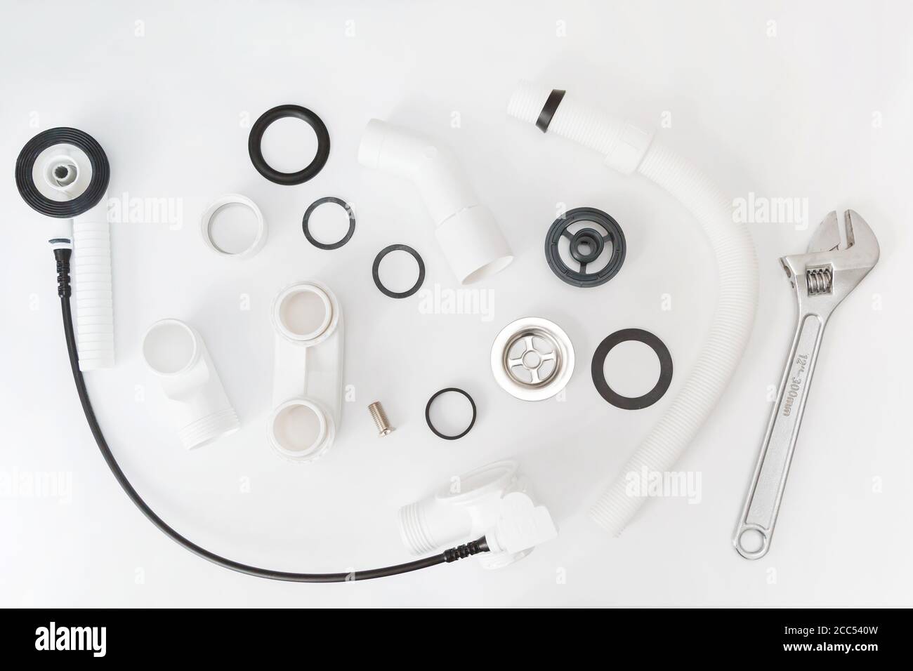 Details plastic siphon kit for bathtub on a white background. Plumbing knolling on white background Stock Photo