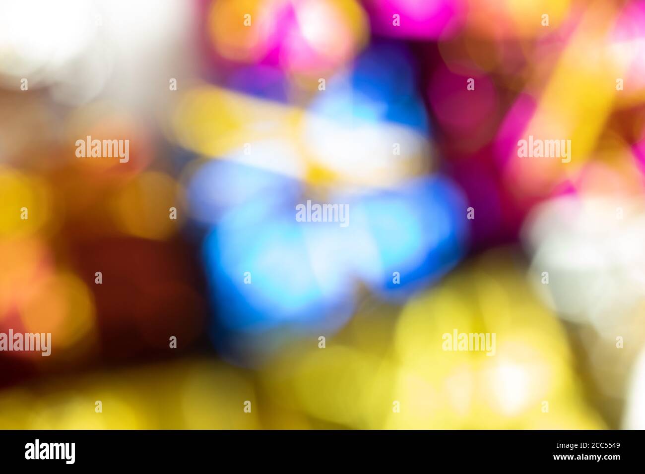 Out of focus blurry background with bright colorful light Stock Photo