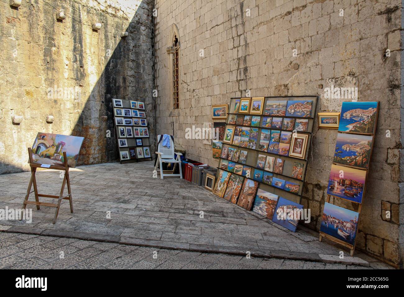 Dubrovnik, Croatia - July 15th 2018: An artists stall in Dubrovnik's old town in a late summers afternoon, Croatia Stock Photo
