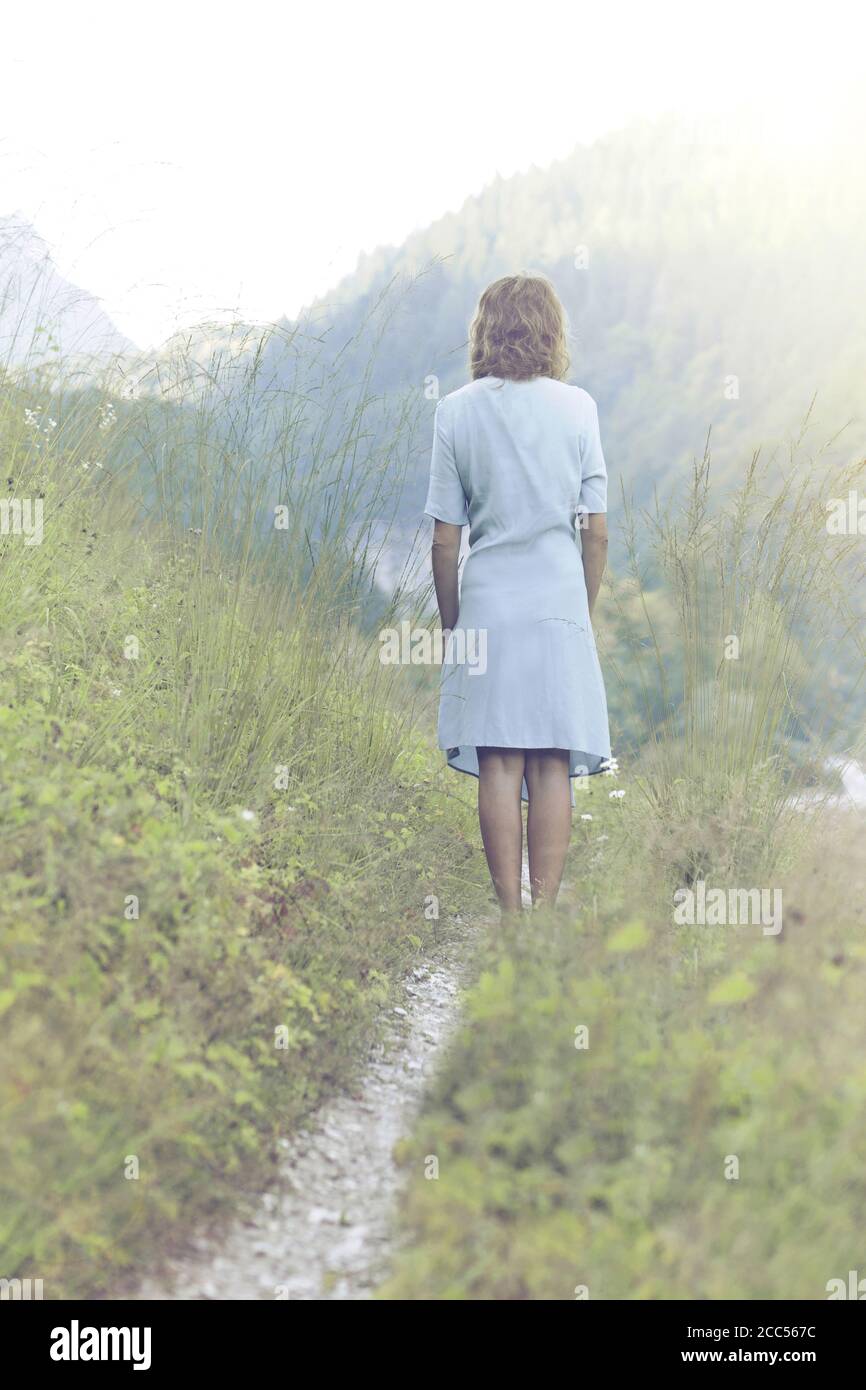 Woman walking on pathway through hi-res stock photography and images ...