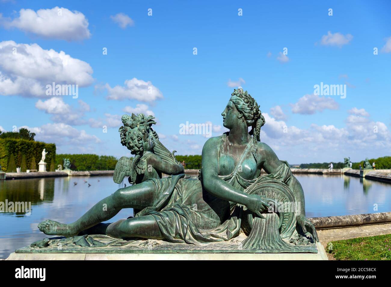 Bronze statue Le Loiret in front of the Palace of Versailles - France Stock Photo
