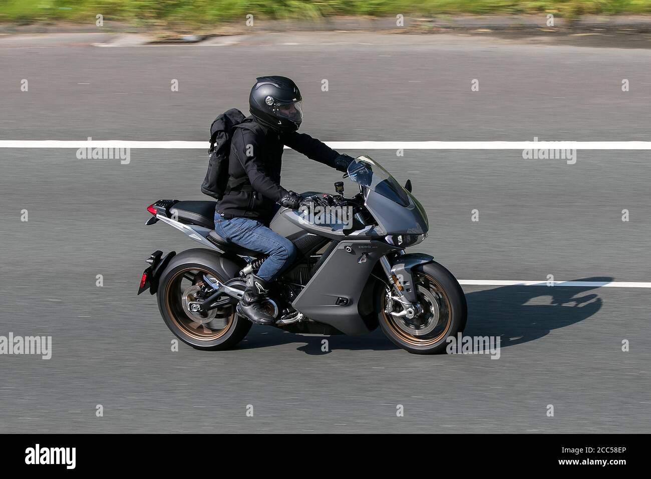 Zero Motorcycle SR/S aerodynamic fairing riding on the M6 motorway near Preston in Lancashire, UK Stock Photo