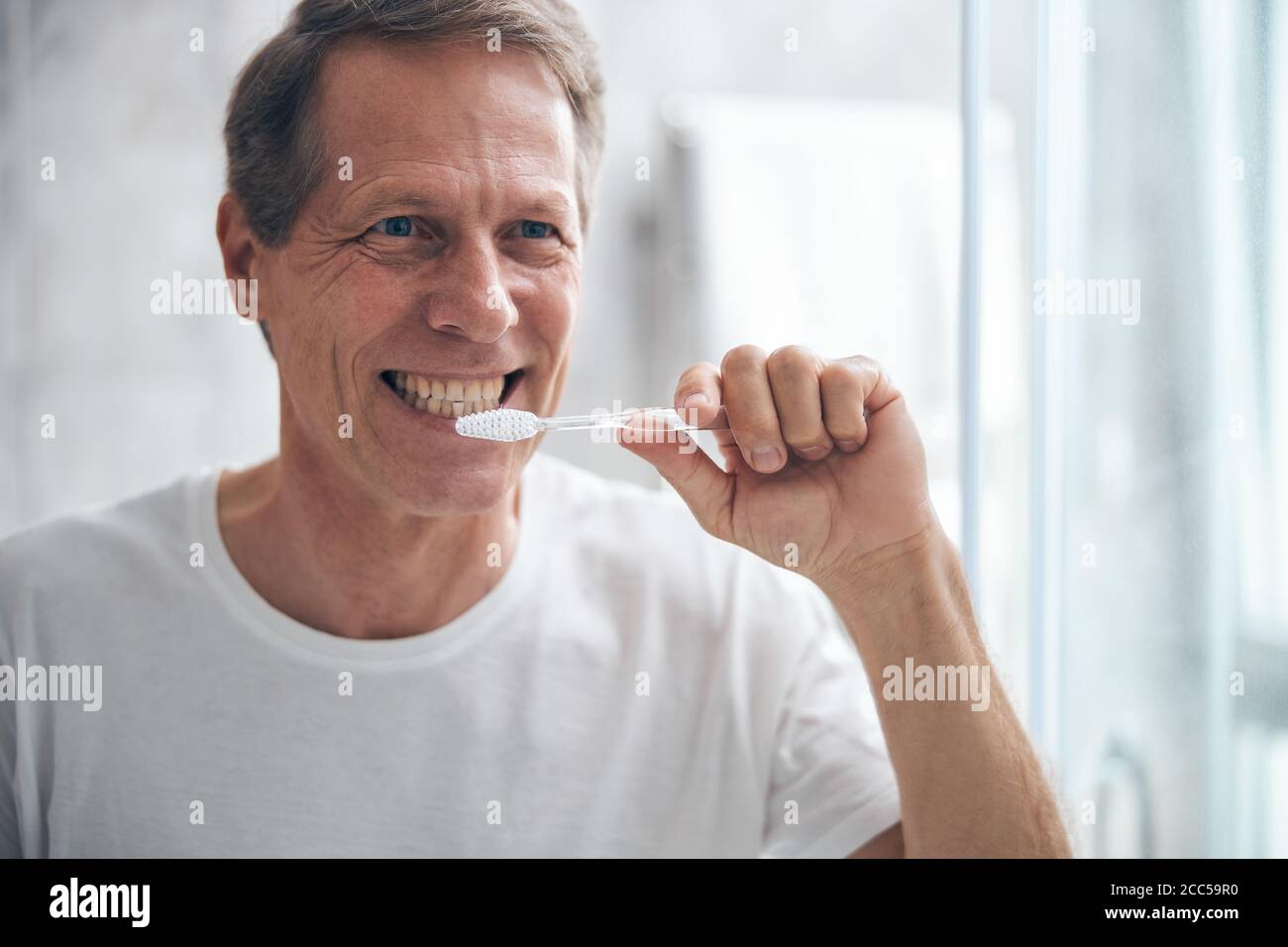 Man taking care of his oral health Stock Photo Alamy