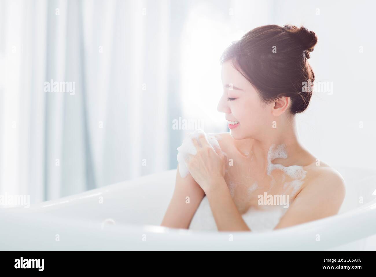 young woman take a bath in bathtub Stock Photo Alamy