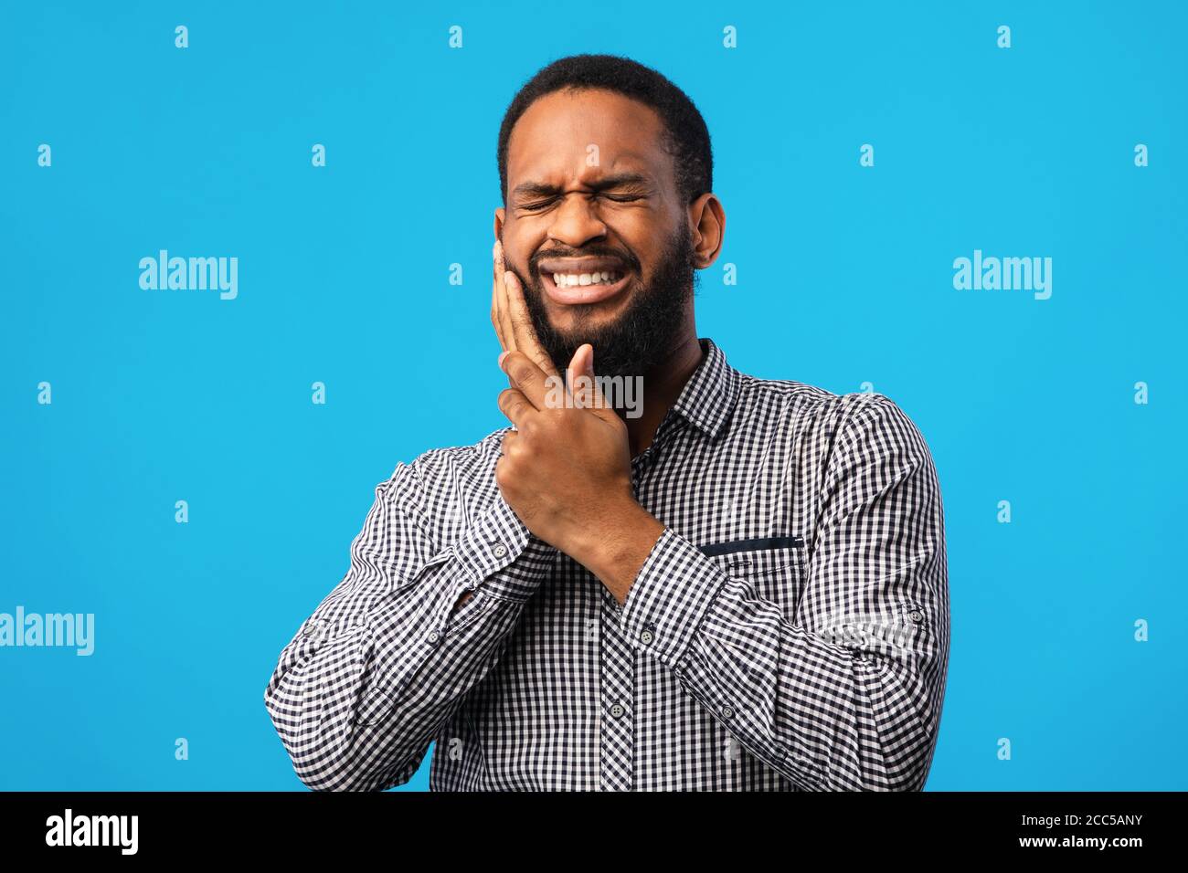 Portrait of handsome black guy with tooth ache Stock Photo Alamy