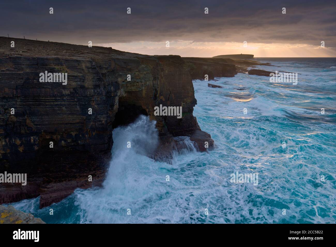 Rough seas and moody sky along Birsay cliffs, Orkney Isles Stock Photo