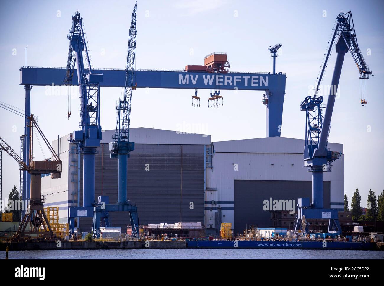 Rostock, Germany. 12th Aug, 2020. The gantry crane with the inscription