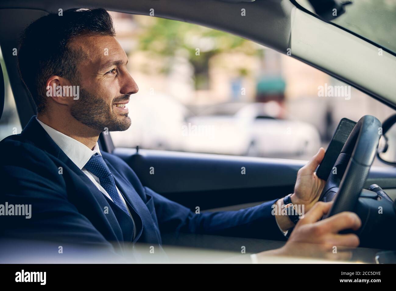 Serious concentrated brunette man in hi-res stock photography and ...