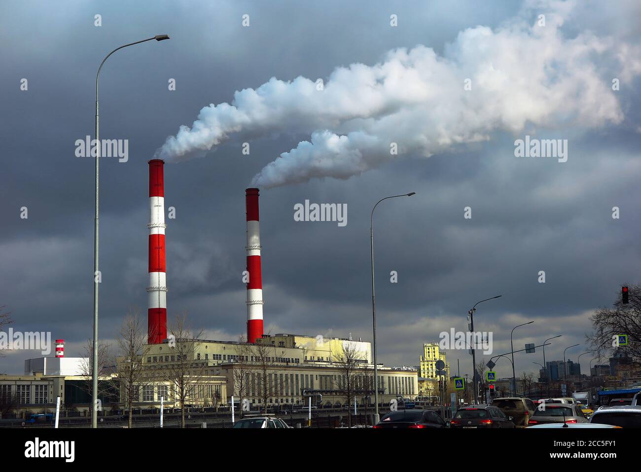 Smoke coming out of the chimneys of a thermal industrial station during winter in Moscow, Russia. Stock Photo