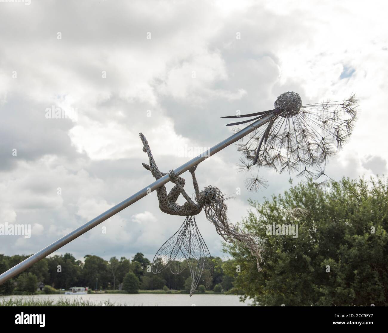 Wire sculptured fairy art work on giant dandelion by Robin Wight on