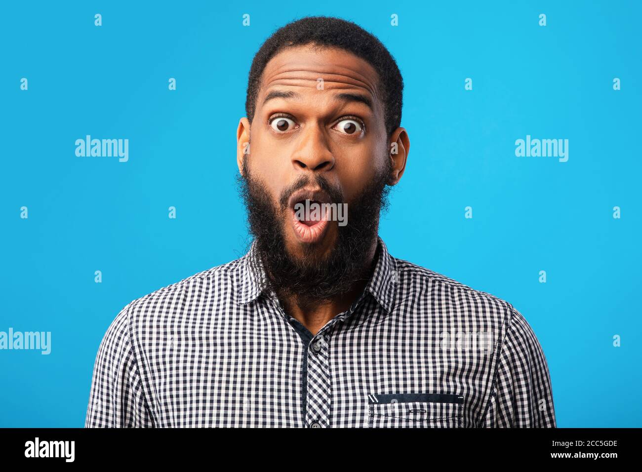 Surprised african american guy looking at camera Stock Photo