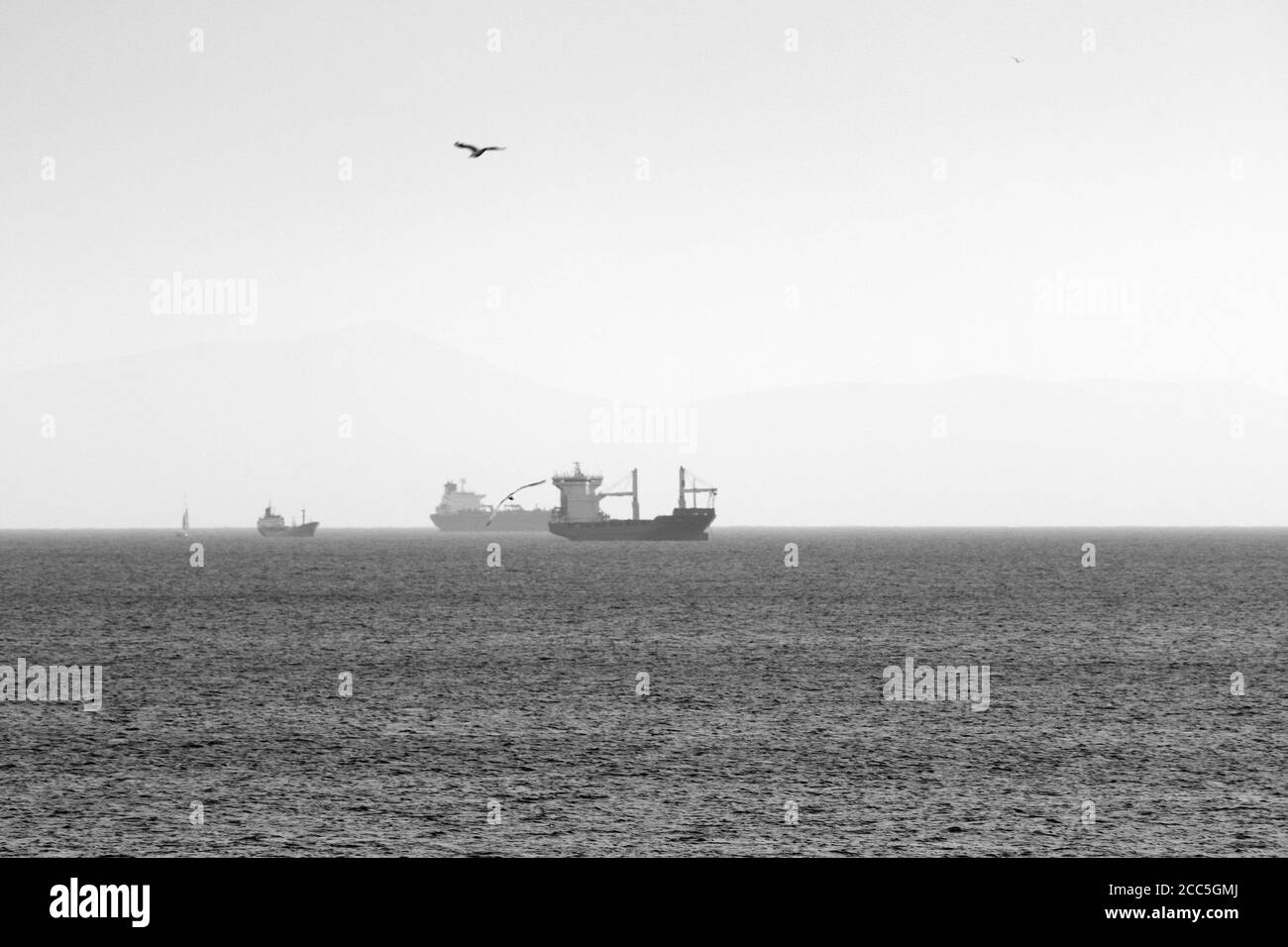 Merchant ships in the Saronic Gulf outside Piraeus and Athens, Greece Stock Photo