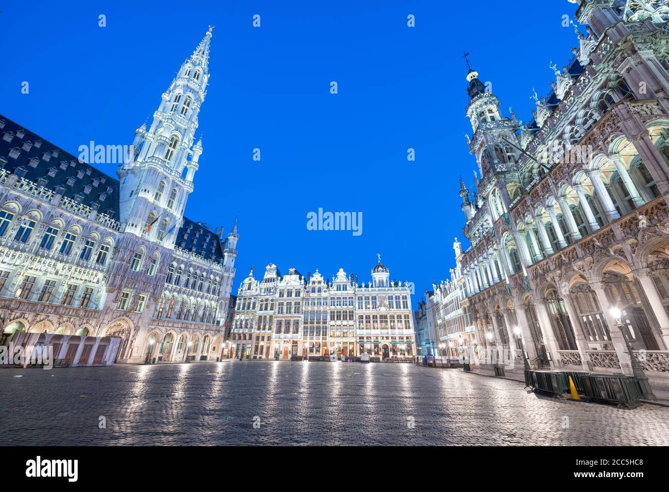 Brussels, Belgium Grand Place with the Town Hall tower at blue hour. Stock Photo