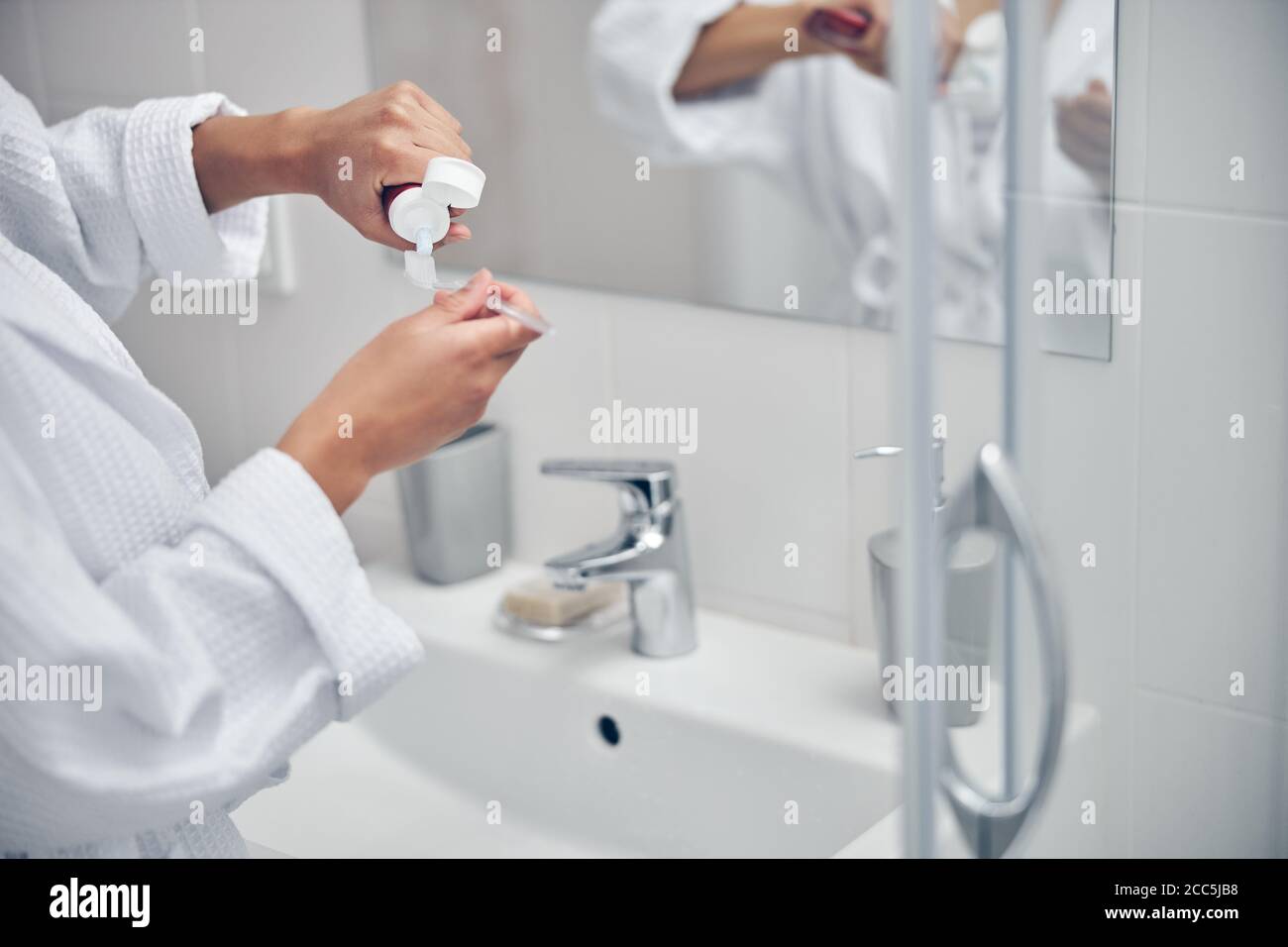 Woman taking care of her oral health Stock Photo