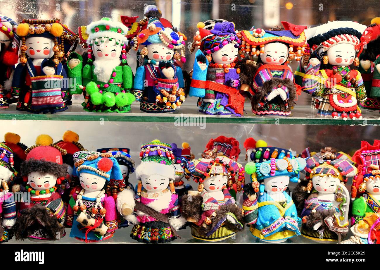 SHANGHAI, CHINA - May 7, 2017 - Handmade dolls are sold as souvenirs from China in national clothes Stock Photo