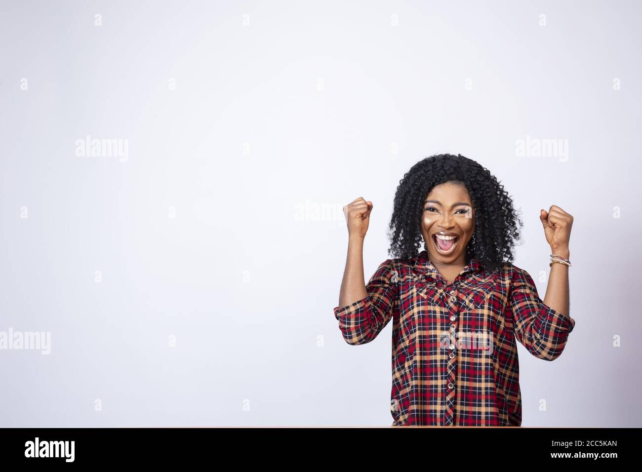 Excited cheerful african woman hi-res stock photography and images - Alamy