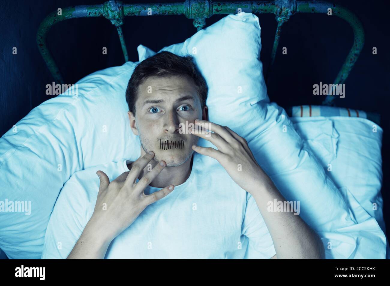 Premium Photo  Blindfolded crazy man sitting in bed, dark room..  psychedelic male person having problems every night, depression and stress,  sadness, psychiatry hospital