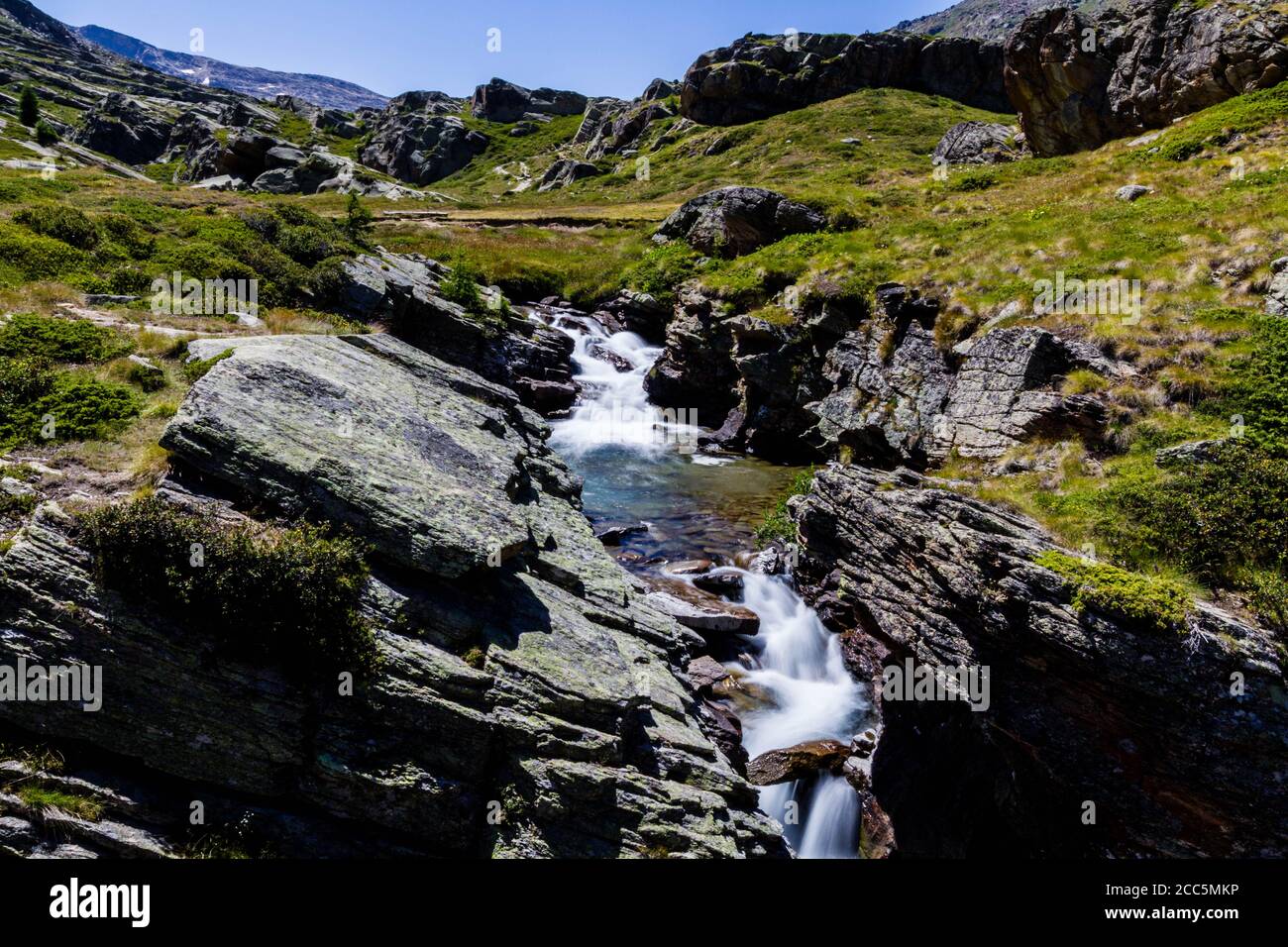 River by the hiking trail in Gran Paradiso Stock Photo