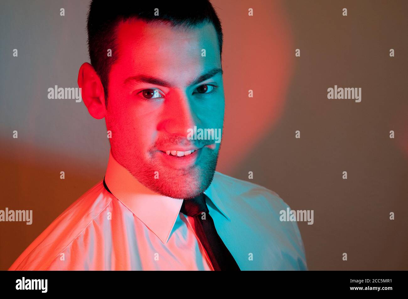 Young executive smiling and looking at the camera. Stock Photo