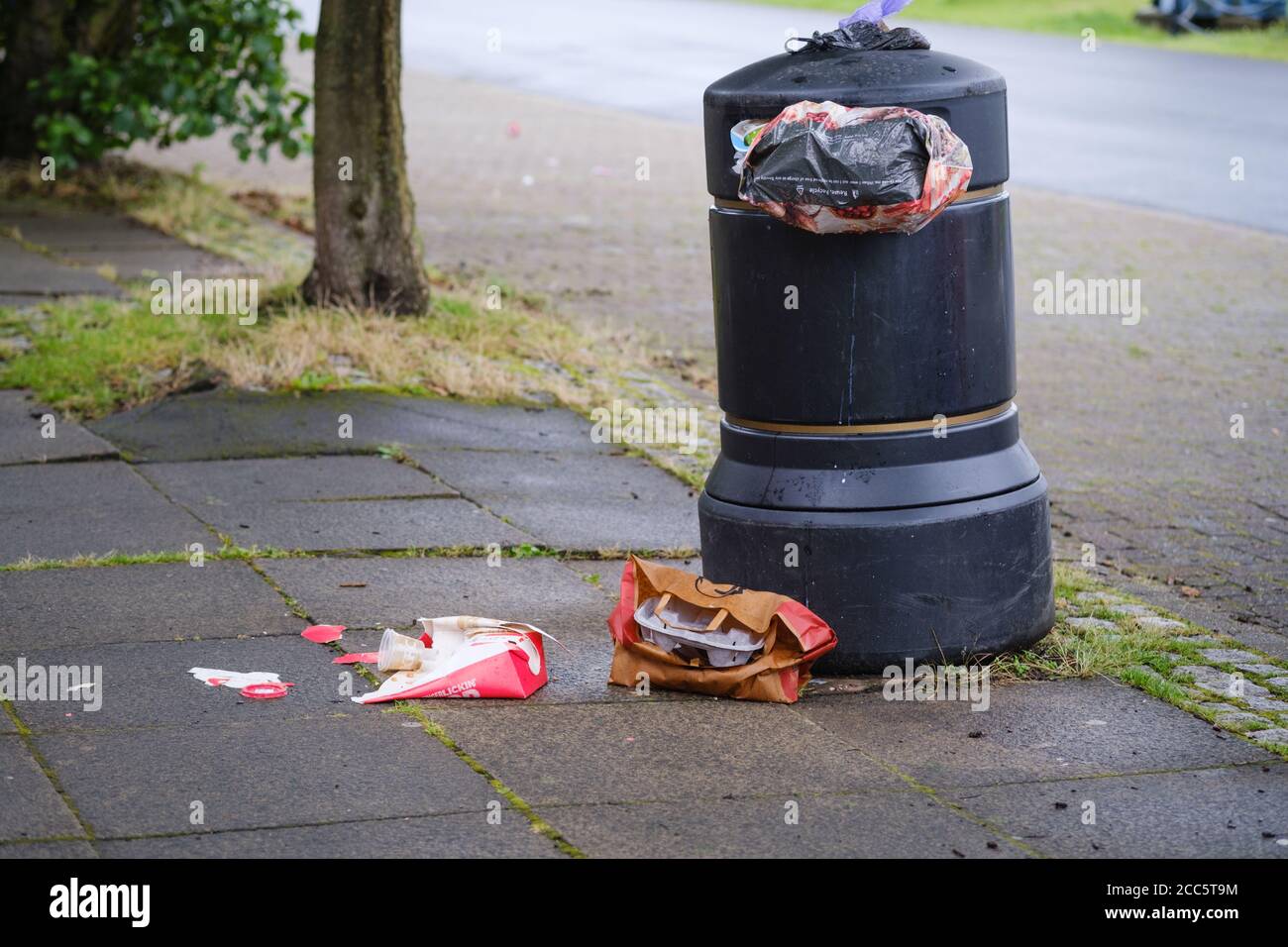 Rubbish and Litter surrounding a Litter Bin at Preston Docks in Lancashire. Stock Photo