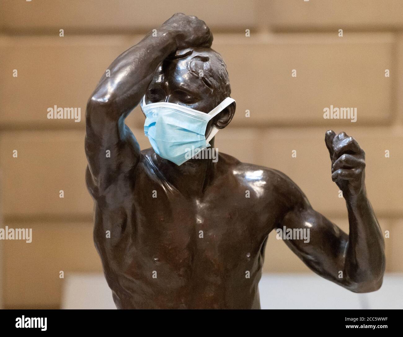 Manchester, UK. 19th Aug, 2020. A face covering is seen on part of the Rodin sculpture 'Eve and Age of Bronze' as Manchester Art Gallery prepares to reopen its doors to the public on Thursday 20th August following temporary closure during the Covid-19 outbreak Credit: Russell Hart/Alamy Live News Stock Photo