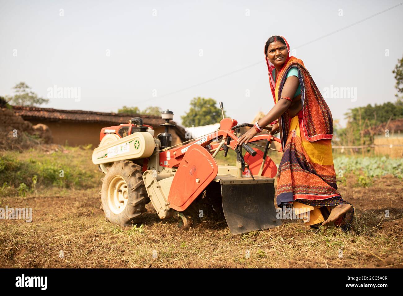 Nirmala Devi (32) operates a soil tiller on her farm in Bihar India. Women like Nirmala have been empowered and their livelihoods have been strengthened through Partnership Bihar, a Lutheran World Relief initiative that brings better farming techniques, high-quality seeds, improved nutrition for families, and microfinance self-help groups to communities in one of India’s poorest states. Stock Photo