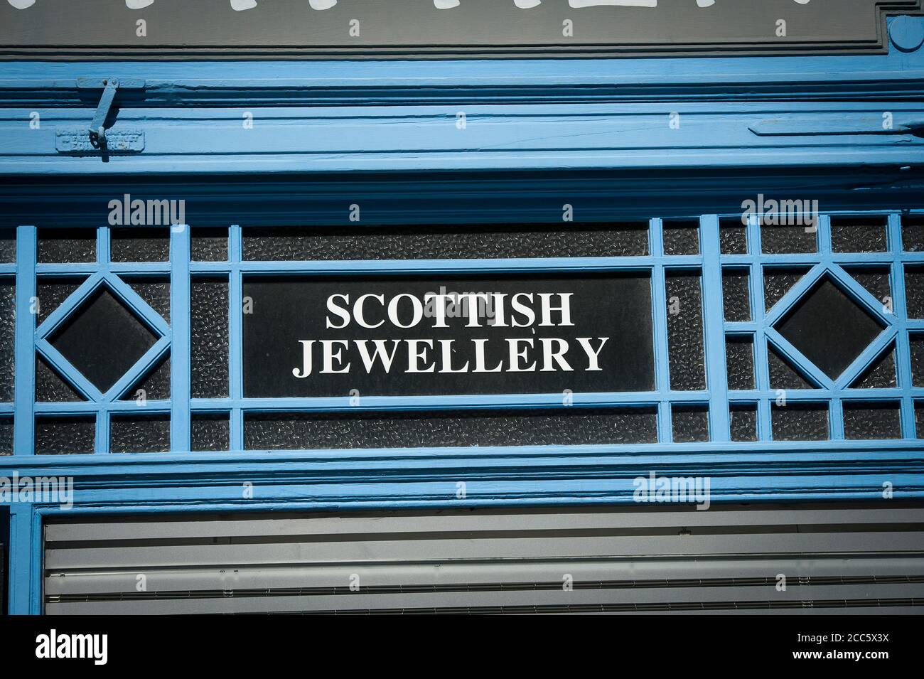 Sign over a shop doorway on the Royal Mile, City of Edinburgh, Scotland