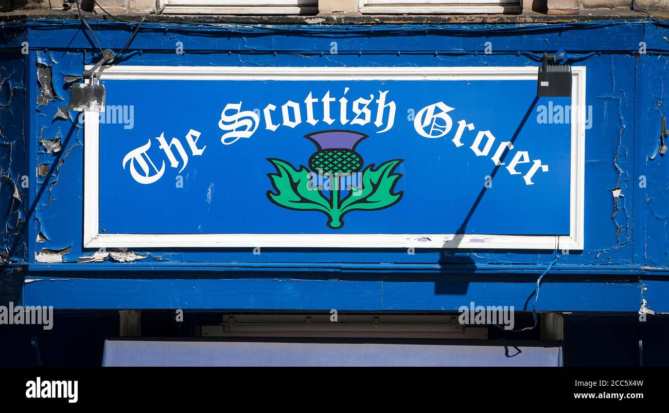 Sign over a shop doorway on the Royal Mile, City of Edinburgh, Scotland