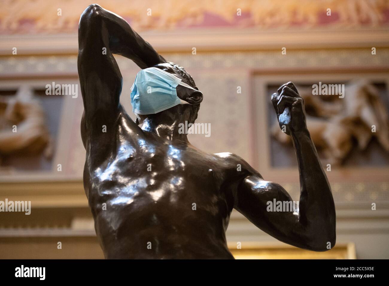 Manchester, UK. 19th Aug, 2020. A face covering is seen on part of the Rodin sculpture 'Eve and Age of Bronze' as Manchester Art Gallery prepares to reopen its doors to the public on Thursday 20th August following temporary closure during the Covid-19 outbreak Credit: Russell Hart/Alamy Live News Stock Photo