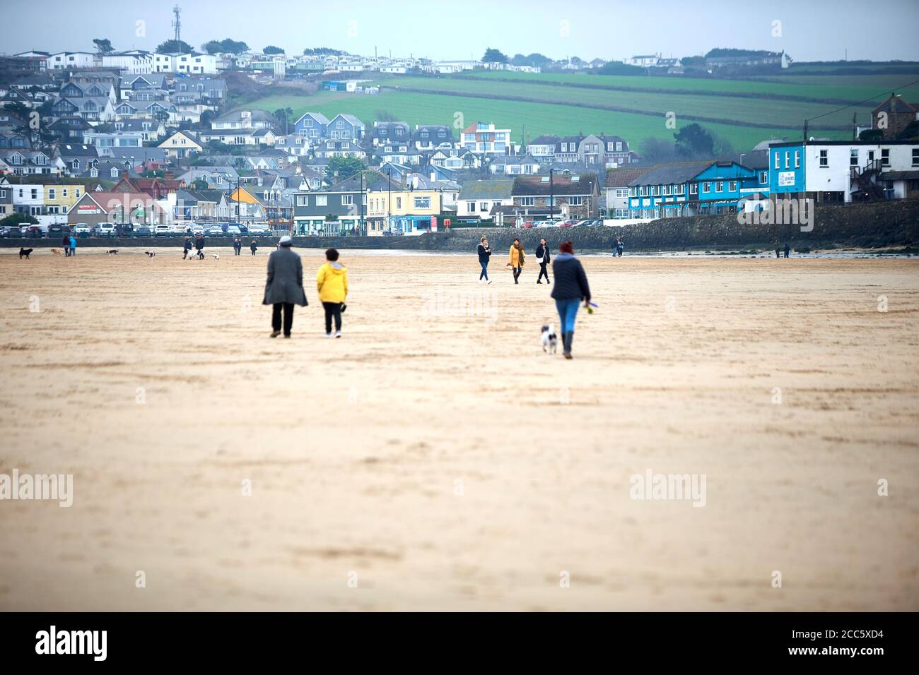 People walking on Perranporth beach in Cornwall on Christmas Day Stock Photo