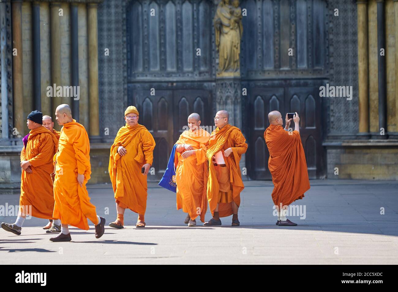 Buddhist monks visiting Westminster Abbey in London Stock Photo