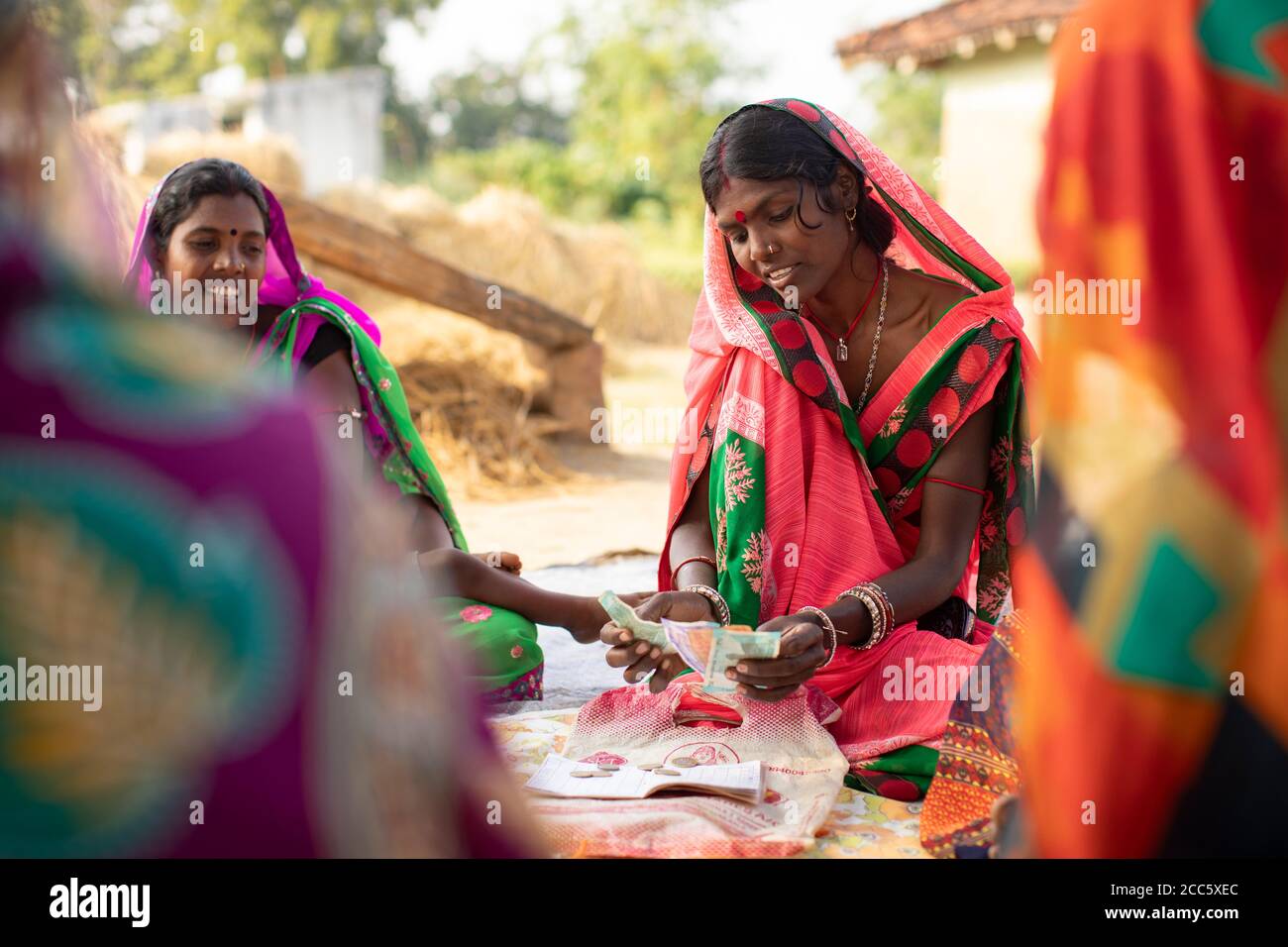 Women save and lend amongst each other in a village savings and loan