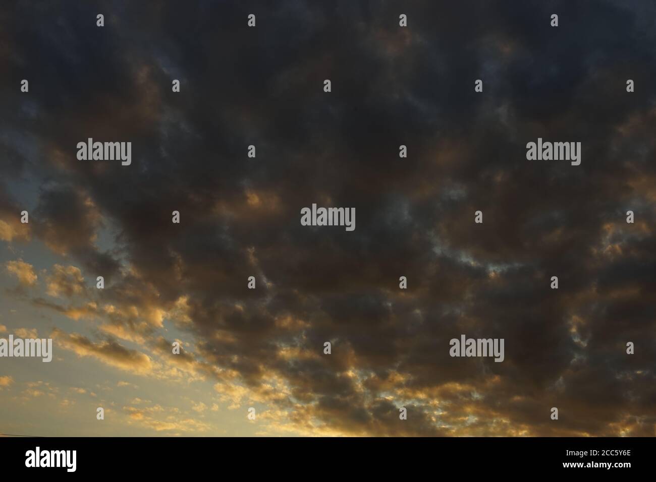 background dark cloudy sky in summer sunset Stock Photo