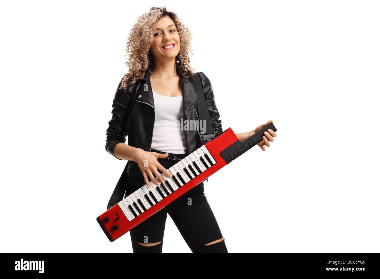 Female musician with a curly blond hair playing a keytar synthesizer isolated on white background Stock Photo