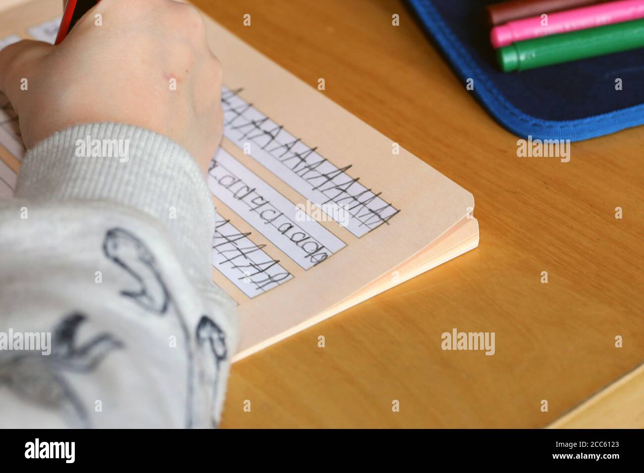 Symbol image: First grader learns writing Stock Photo - Alamy