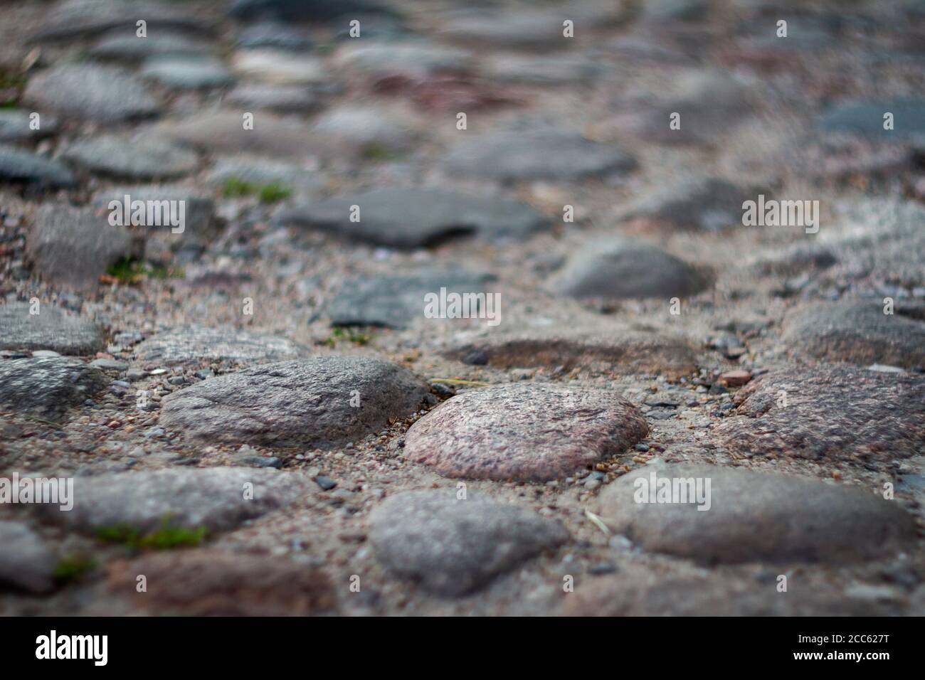 Closeup shot of old cobblestone with low deph of field. Stock Photo