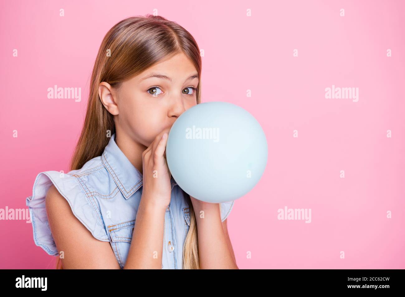 Girls Blowing Balloons