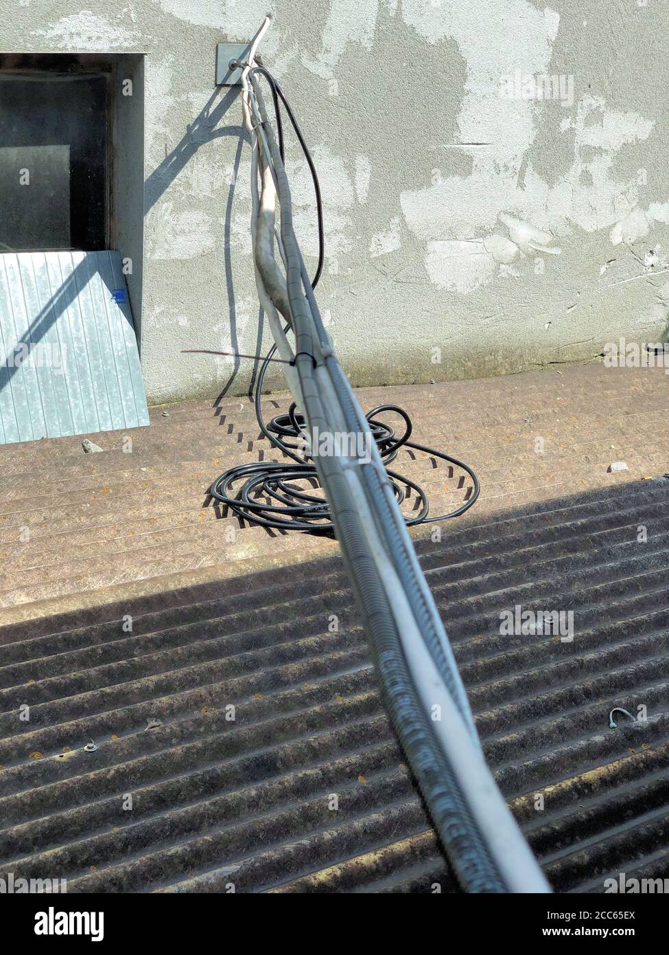 Electric cables hanging there Stock Photo Alamy