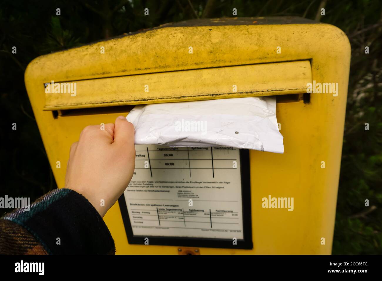 injecting a letter to the post box Stock Photo