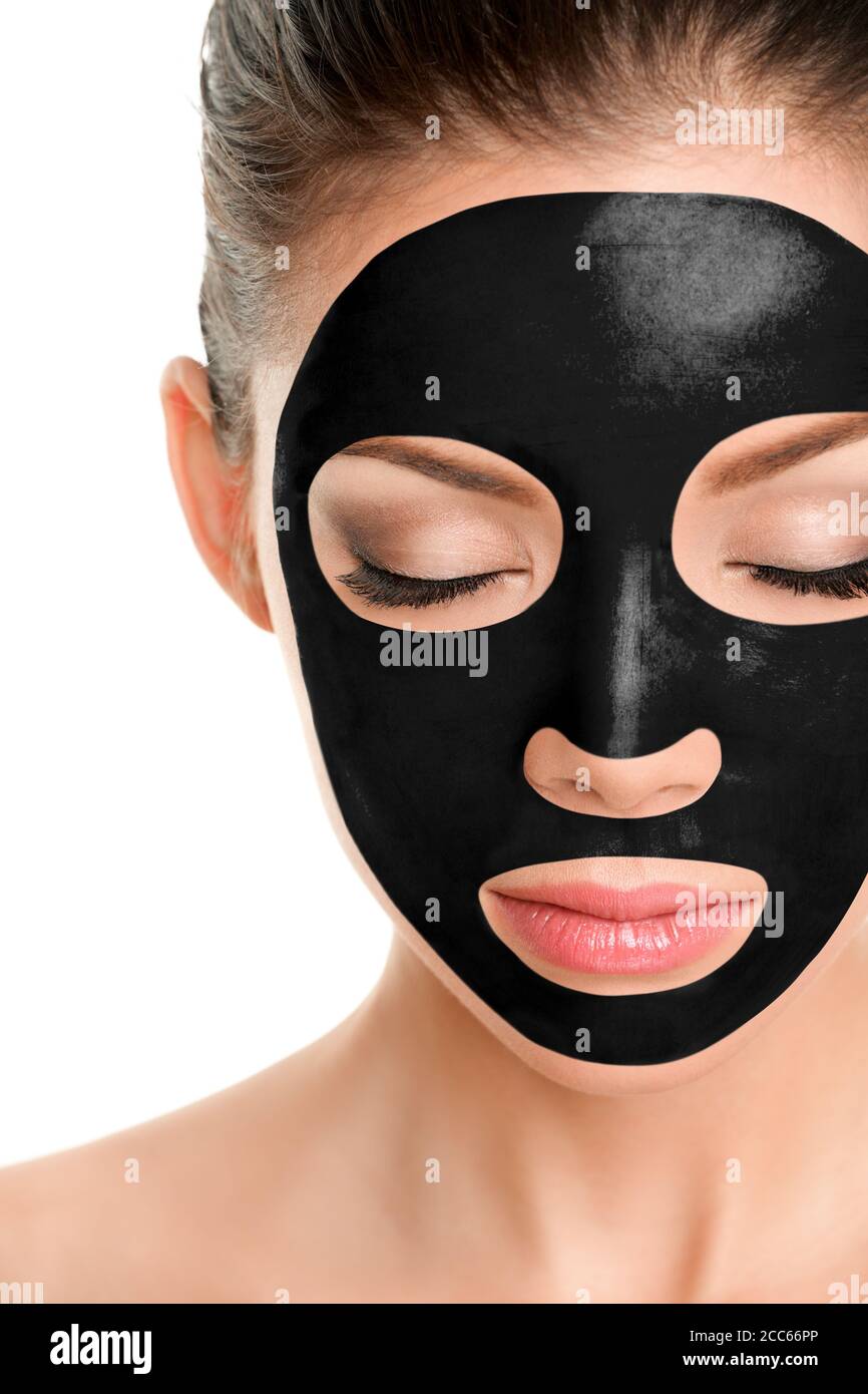 Charcoal face mask peel off facial treatment Asian beauty woman using  chemical black mask therapy Stock Photo - Alamy