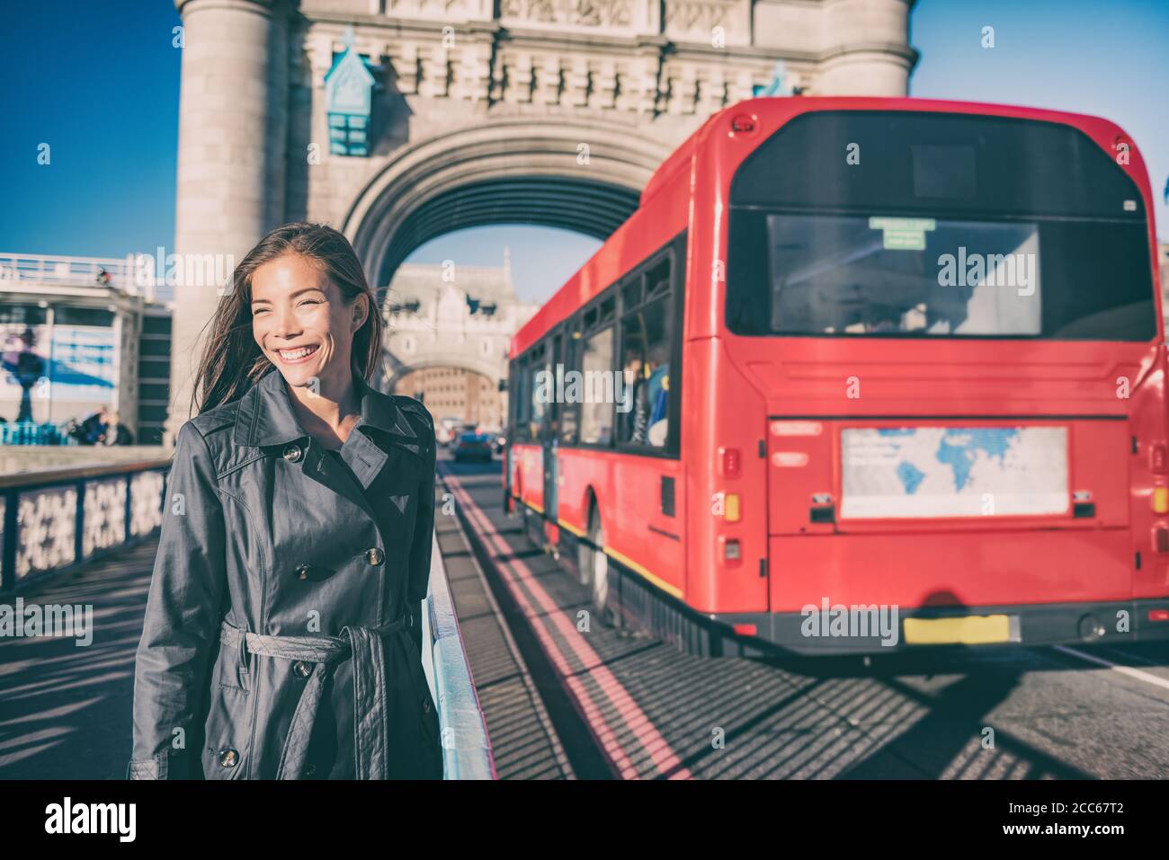 London travel tourist walking on Tower bridge street by red british bus on famous tourism attraction Europe summer vacation destination Stock Photo