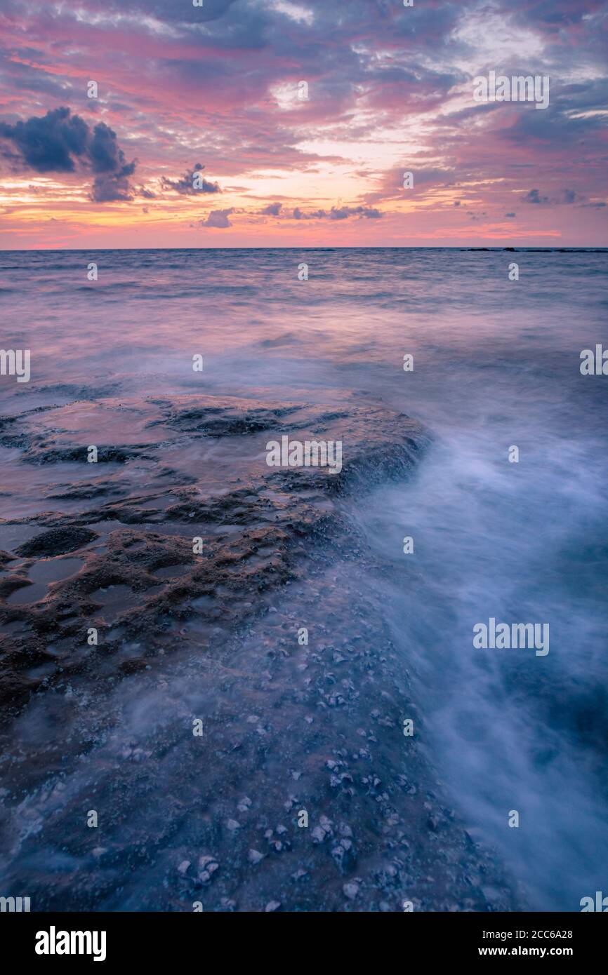 Long exposure seascape rocks at twilight Stock Photo - Alamy