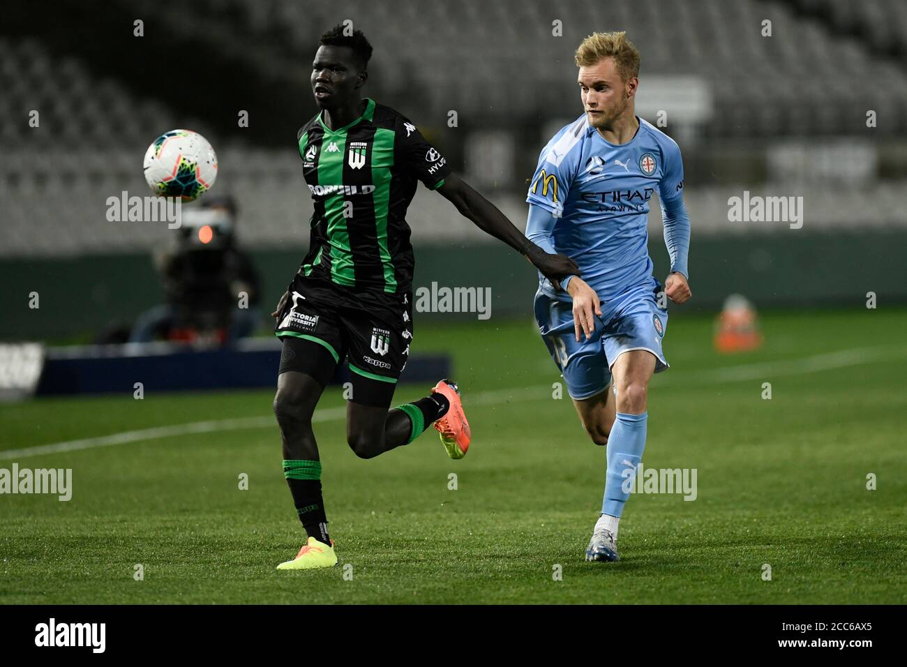 19th August 2020; Jubilee Oval, Sydney, New South Wales, Australia; A League Football, Western United FC versus Melbourne City FC; Nathaniel Atkinson of Melbourne City holds off the challenge from Kuach Yuel of Western United Stock Photo