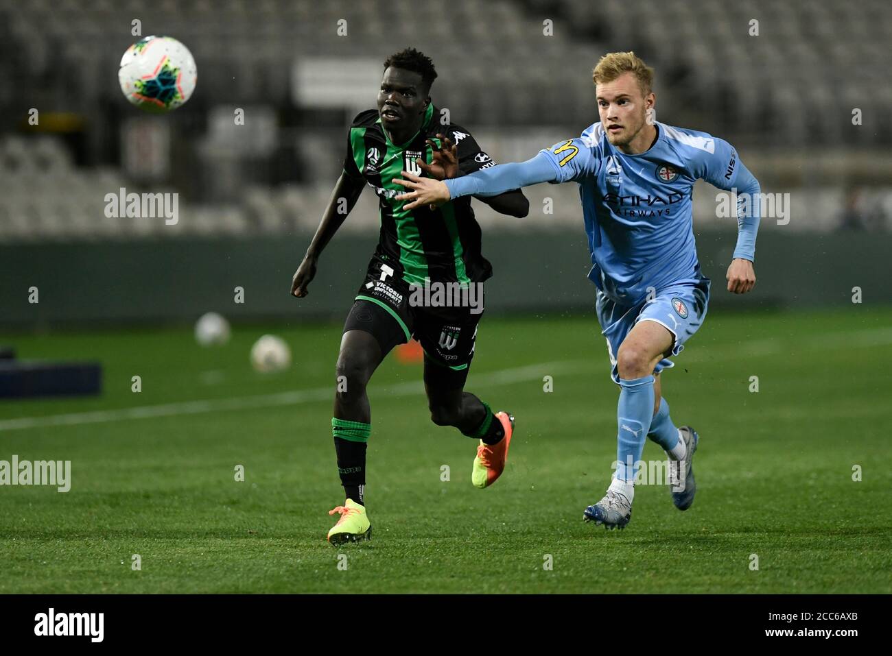 19th August 2020; Jubilee Oval, Sydney, New South Wales, Australia; A League Football, Western United FC versus Melbourne City FC; Nathaniel Atkinson of Melbourne City holds off the challenge from Kuach Yuel of Western United Stock Photo