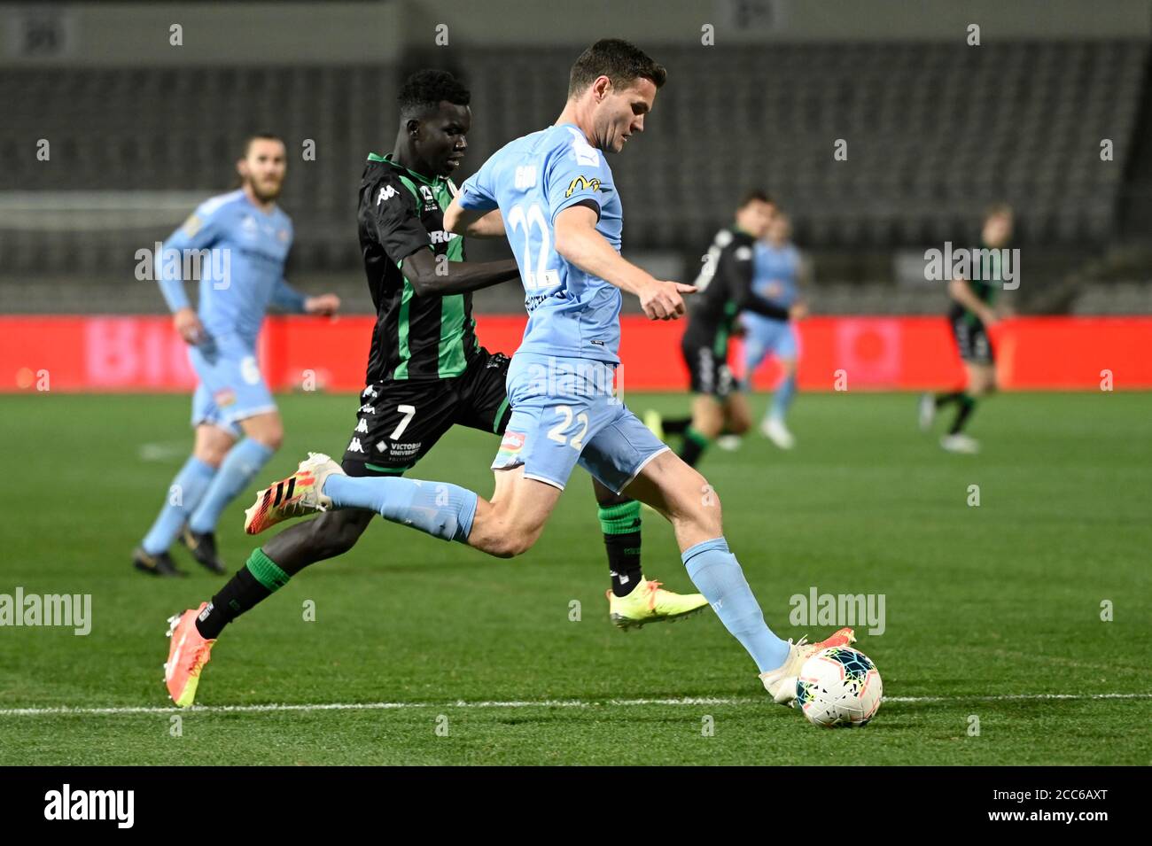 19th August 2020; Jubilee Oval, Sydney, New South Wales, Australia; A League Football, Western United FC versus Melbourne City FC; Curtis Good of Melbourne City passes the ball as Kuach Yuel of Western United closes Stock Photo