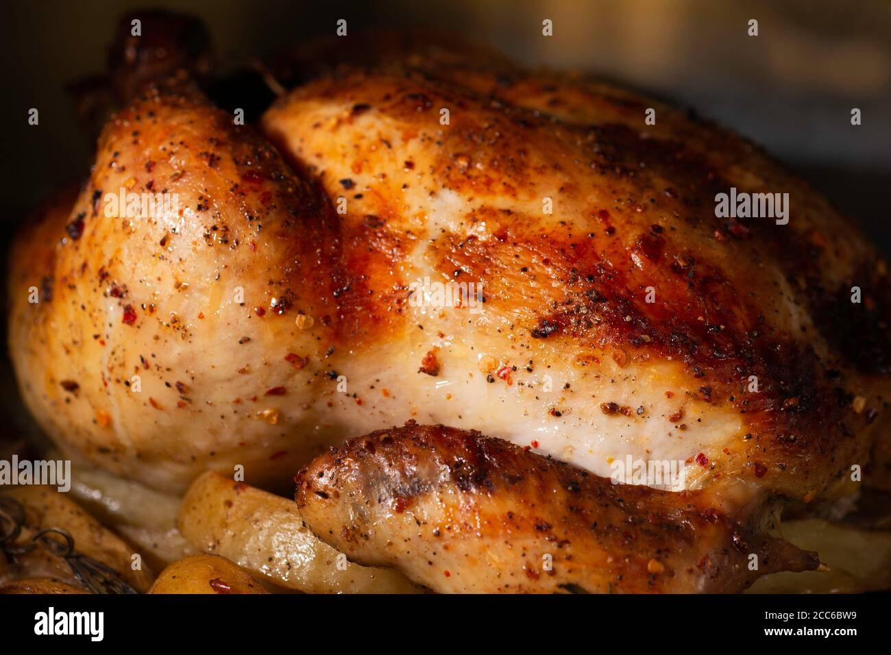 roasting whole chicken in oven Stock Photo Alamy