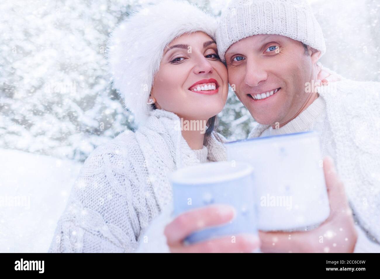 Couple in love portrait in snow forest Stock Photo - Alamy