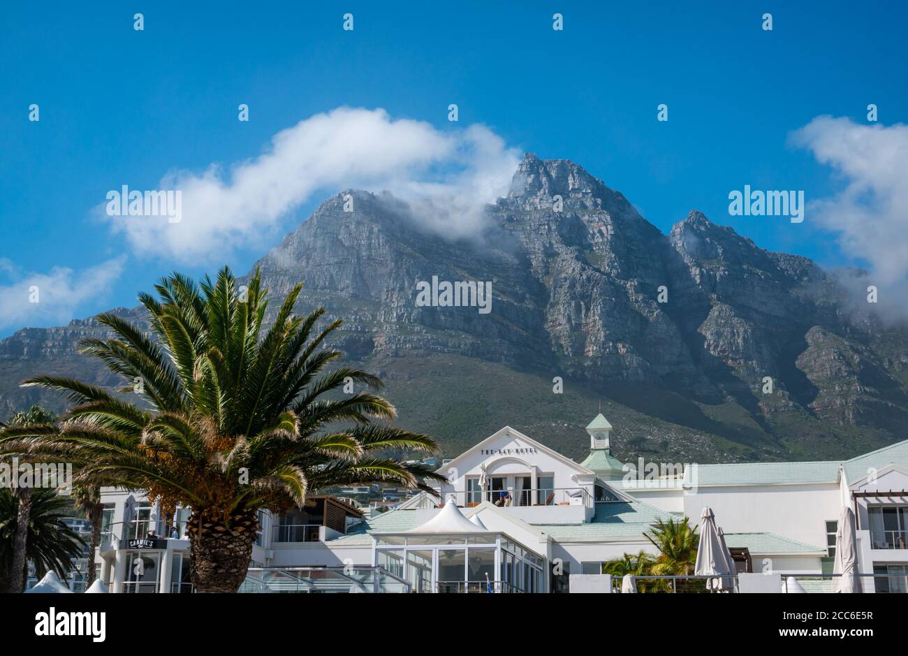 The Bay Hotel, Camps Bay with Table Mountain towering above, Cape Town, South Africa Stock Photo
