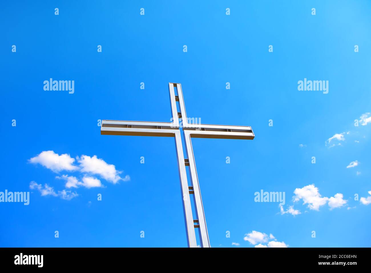 Religious Cross against blue sky Stock Photo